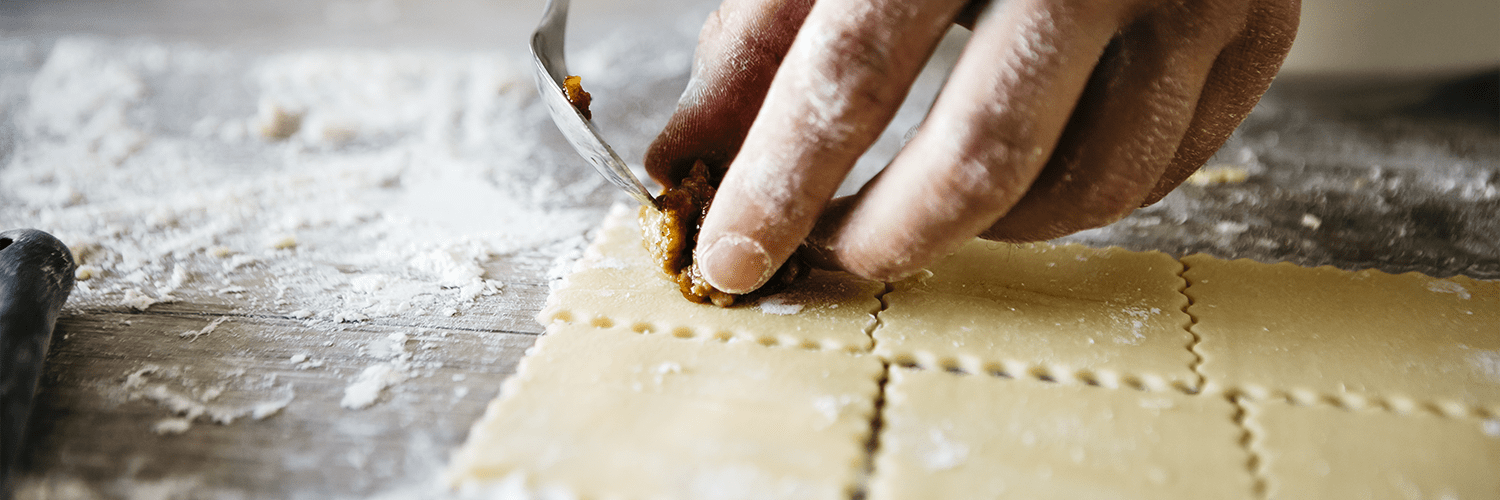 Tortelli di zucca e patate con ricotta e coriandoli di prosciutto crudo